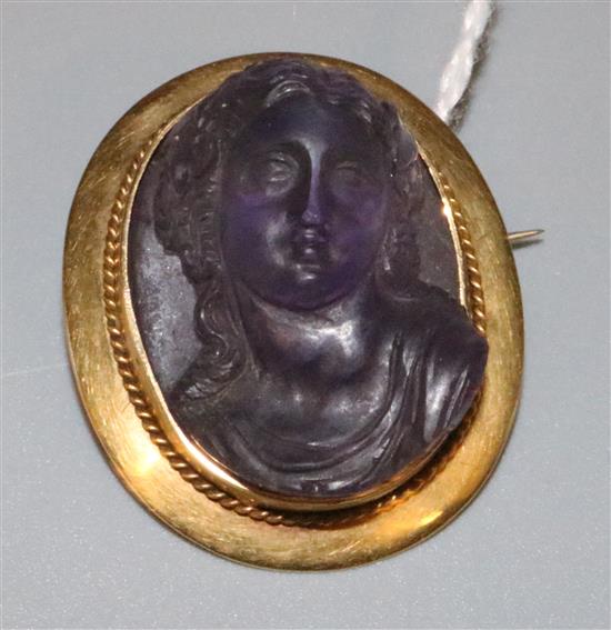 A gold mounted amethyst portrait brooch, 33mm(-)